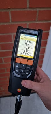 20220111_162511 Emergency plumber using gas analyser during boiler repair in Bletchley
