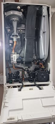 Broken boiler with PCB removed during emergency repair in Bletchley