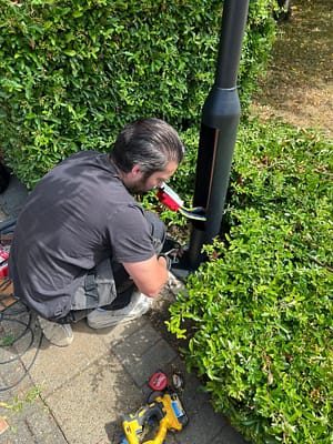 Electrician fixing ec charger in st albans